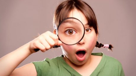 ooking through magnifying glass